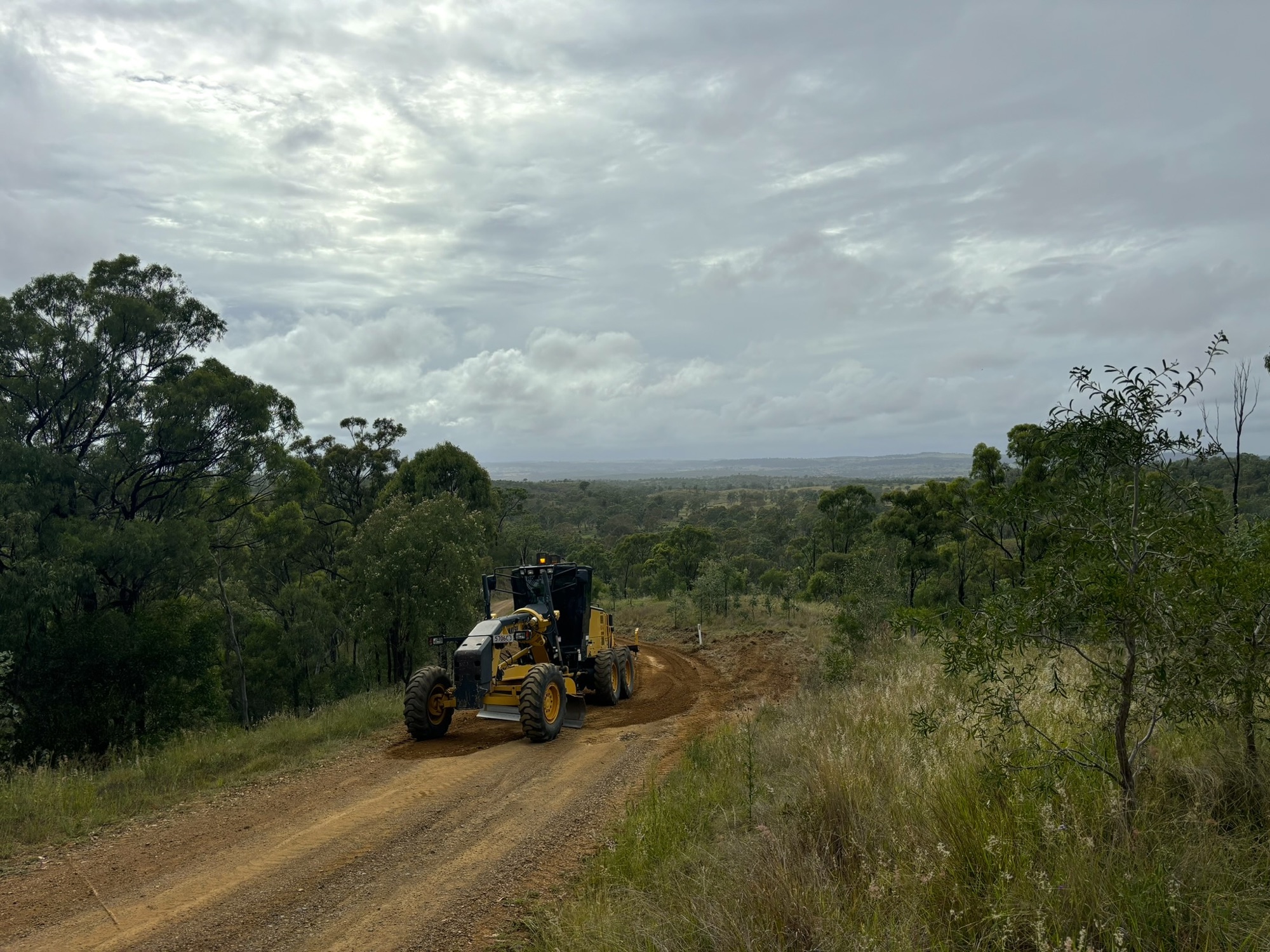 Grader working on a hillside