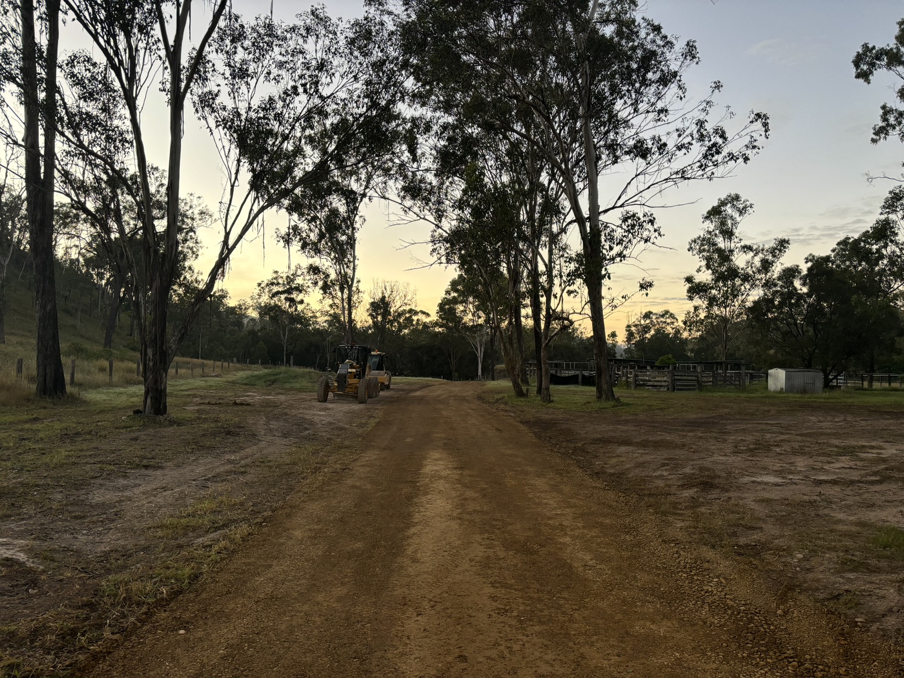 Blackmore grader at work on a rural road at dusk