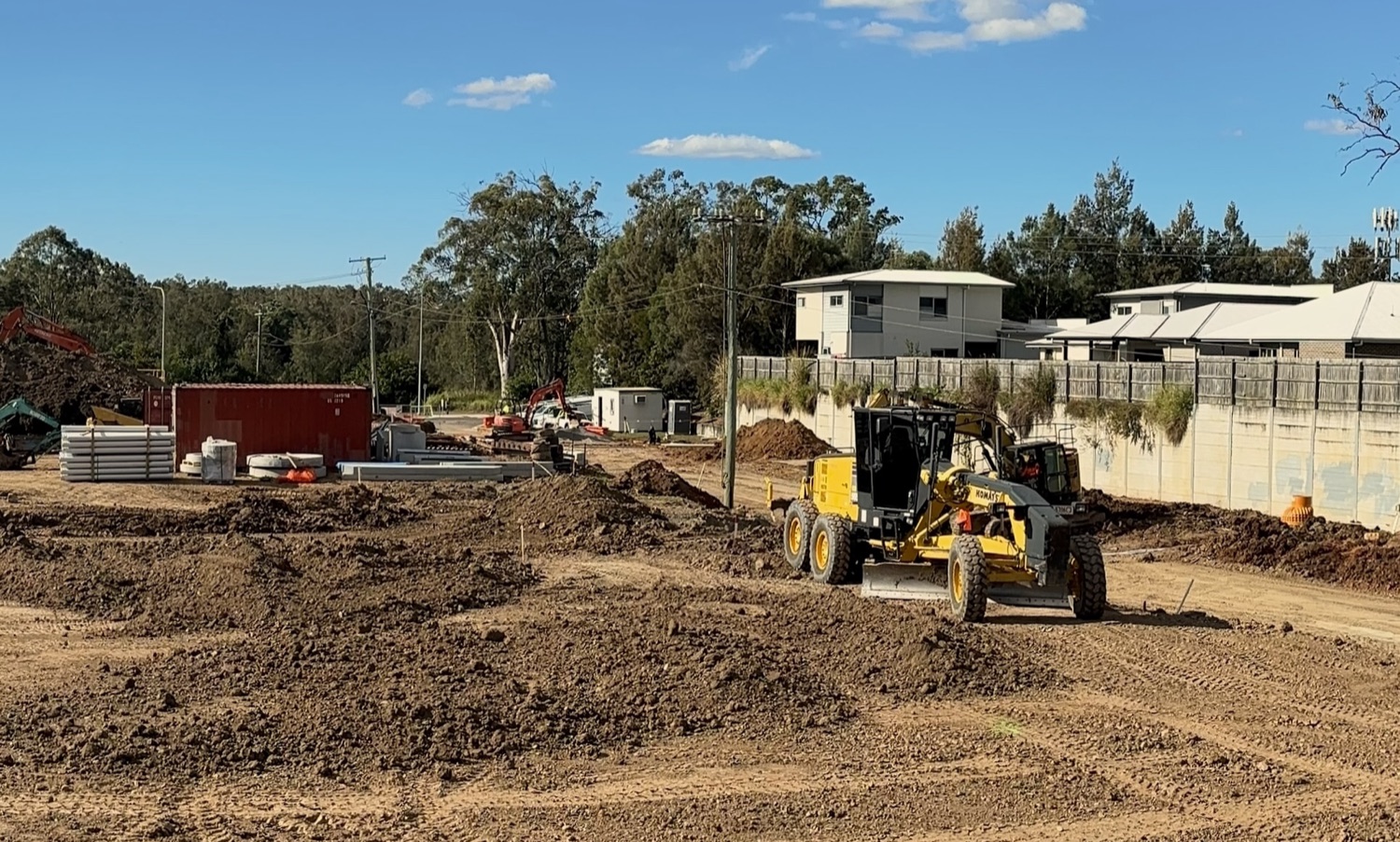 Grader on a gravel road
